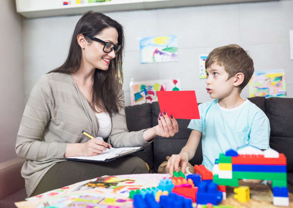 female teaching little kid